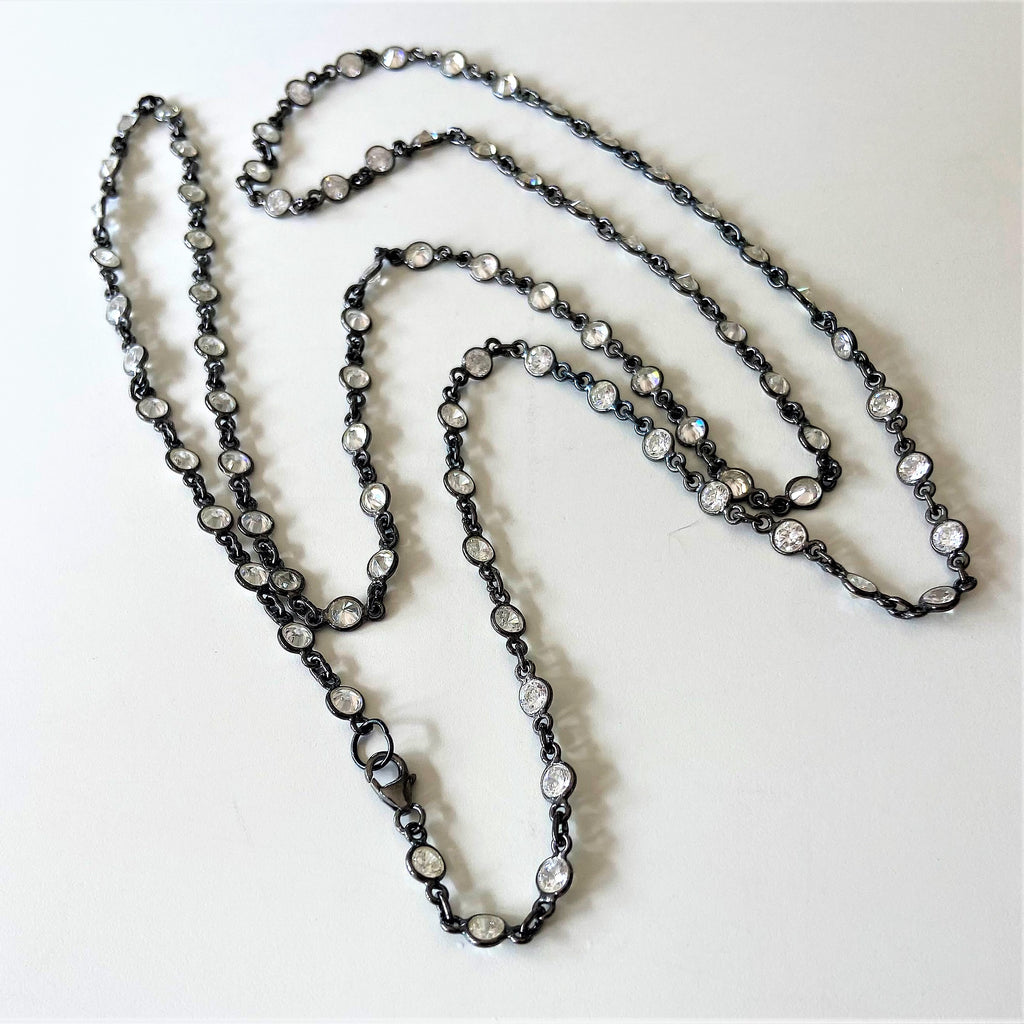 Black rhodium and round quartz long necklace